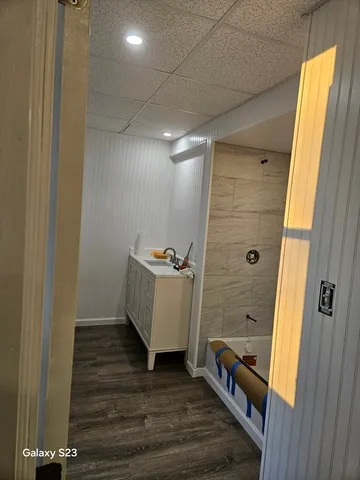 a bathroom with a sink and shower