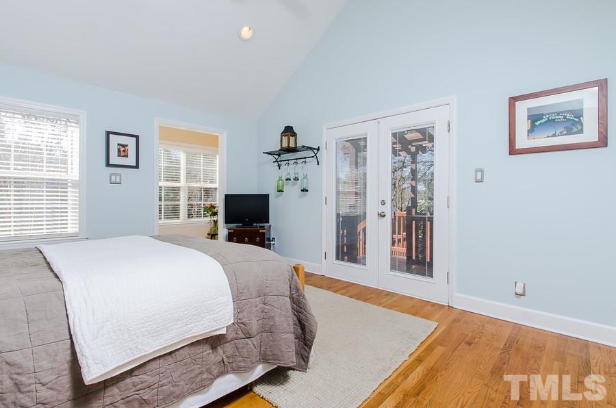 1705 Midwood Drive Raleigh, NC 27604 - Photo 12 of 24 a bedroom with a large bed and a window