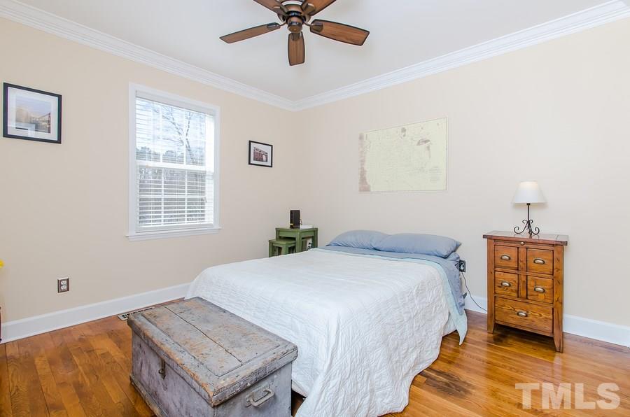 1705 Midwood Drive Raleigh, NC 27604 - Photo 17 of 24 a bedroom with a bed and window
