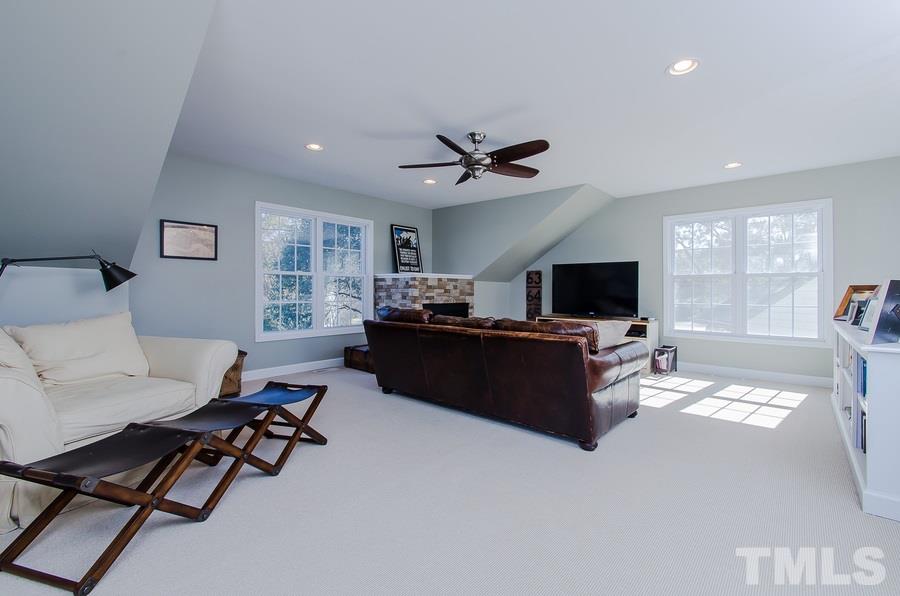 1705 Midwood Drive Raleigh, NC 27604 - Photo 19 of 24 a living room with furniture and a flat screen tv