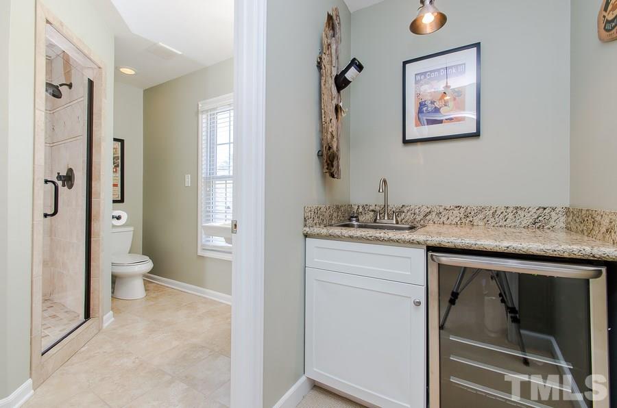 1705 Midwood Drive Raleigh, NC 27604 - Photo 20 of 24 a spacious bathroom with a granite countertop sink mirror and toilet