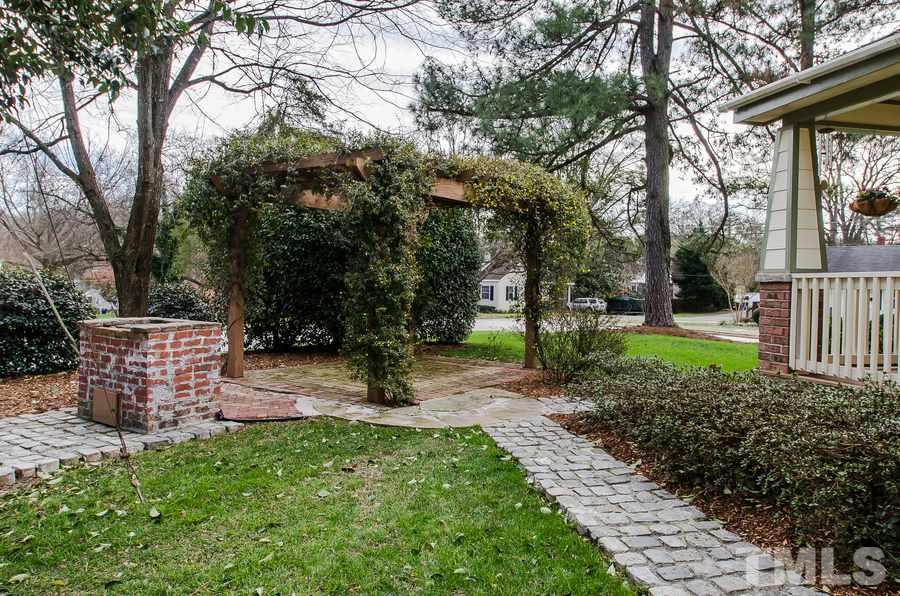 1705 Midwood Drive Raleigh, NC 27604 - Photo 3 of 24 a backyard of a house with lots of green space