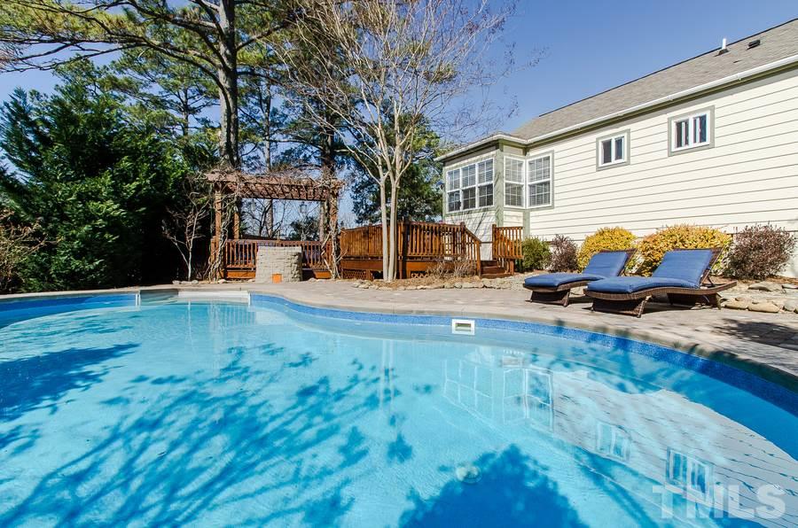 1705 Midwood Drive Raleigh, NC 27604 - Photo 23 of 24 a backyard of a house with table and chairs