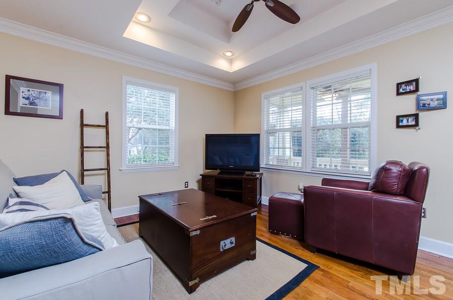 1705 Midwood Drive Raleigh, NC 27604 - Photo 6 of 24 a living room with furniture and a flat screen tv
