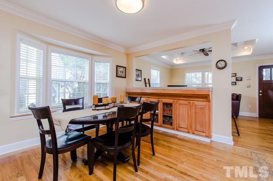 1705 Midwood Drive Raleigh, NC 27604 - Photo 7 of 24 a view of a dining room with furniture and wooden floor