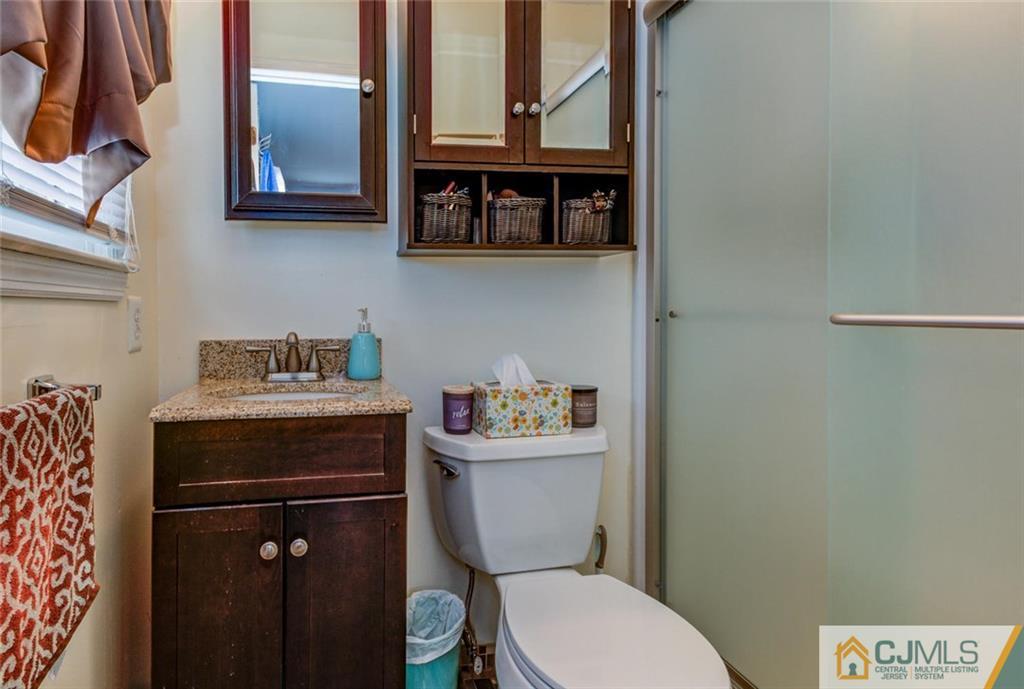 40 Smith Road Somerset, NJ 08873 - Photo 14 of 22 a bathroom with a toilet a sink and a window