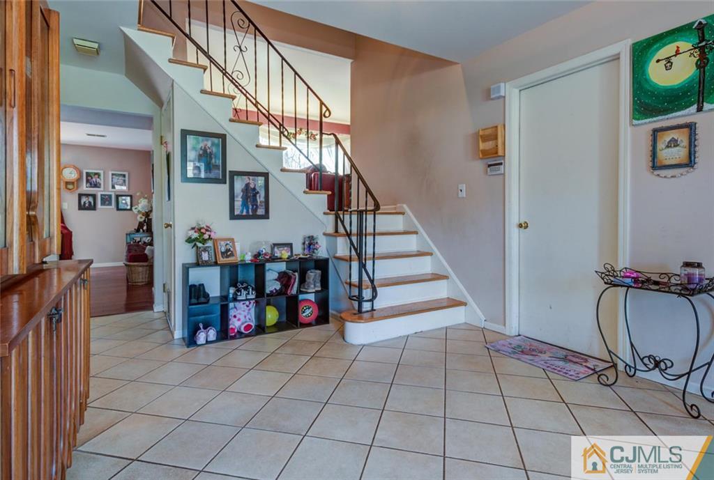 40 Smith Road Somerset, NJ 08873 - Photo 3 of 22 a view of entryway with dining area and stairs
