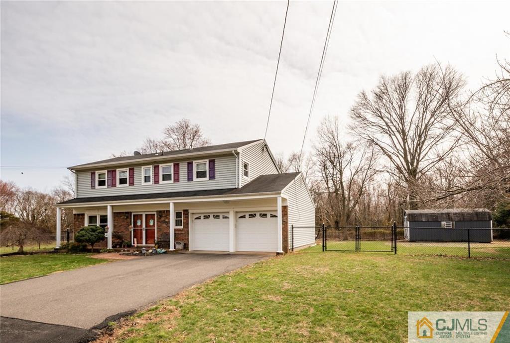 40 Smith Road Somerset, NJ 08873 - Photo 22 of 22 a view of a big house with a big yard and large trees