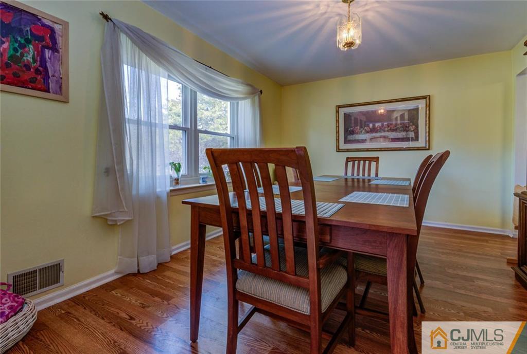 40 Smith Road Somerset, NJ 08873 - Photo 4 of 22 a view of a dining room with furniture window and wooden floor