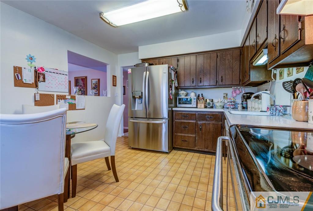 40 Smith Road Somerset, NJ 08873 - Photo 6 of 22 a kitchen with a sink appliances and cabinets