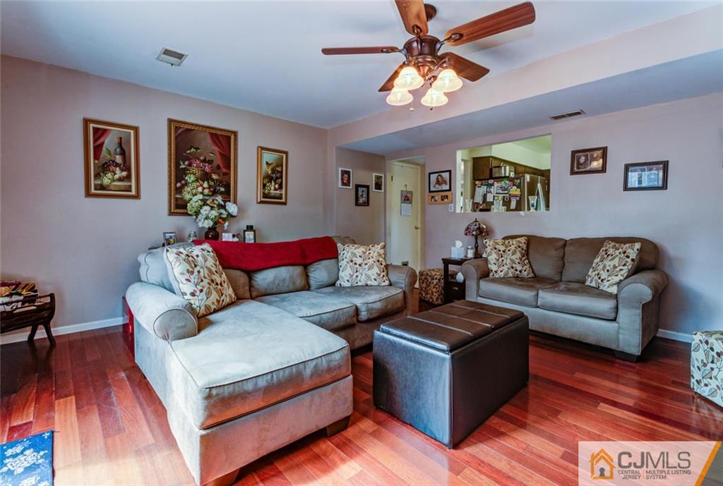40 Smith Road Somerset, NJ 08873 - Photo 9 of 22 a living room with furniture and a wooden floor