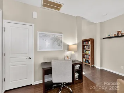 a view of a livingroom with furniture and a wooden floor