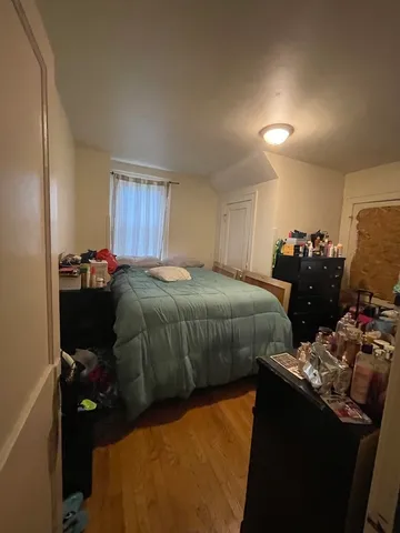 a bedroom with a bed and a closet