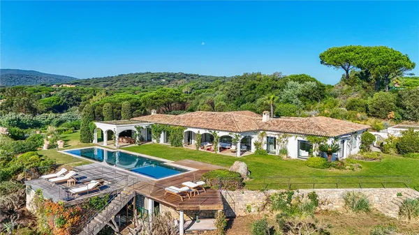 an aerial view of a house with a big yard