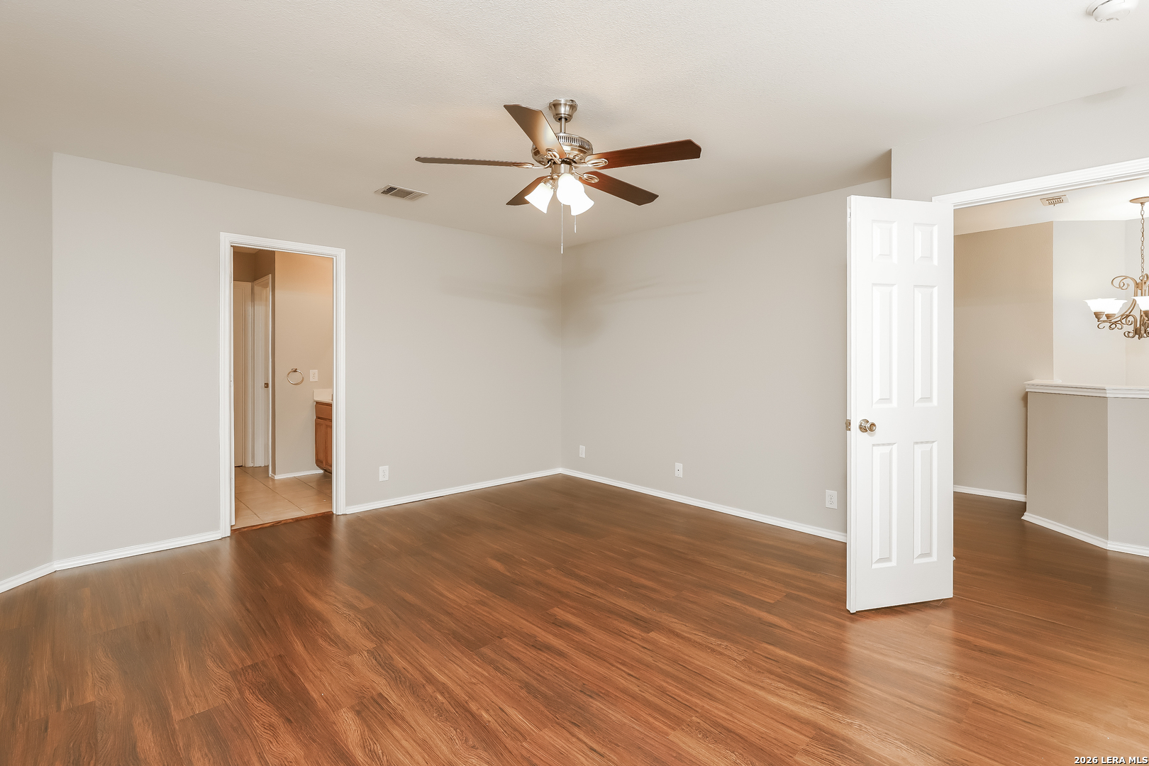 8611 Tioga Pass Helotes, TX 78023 - Photo 4 of 14 a view of an empty room with wooden floor