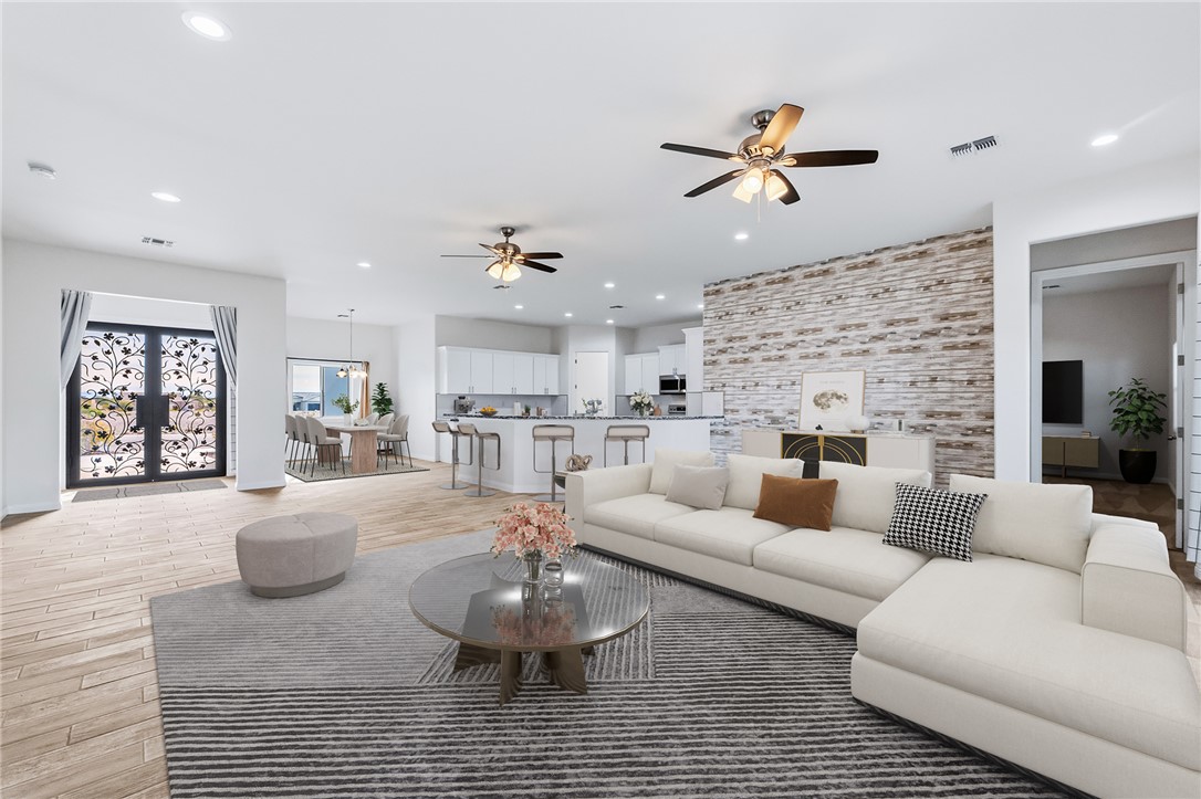2385 Corwin Road Bullhead City, AZ 86442 - Photo 11 of 78 a living room with furniture kitchen view and a chandelier