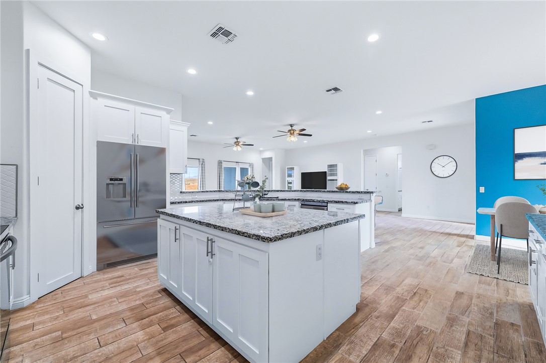 2385 Corwin Road Bullhead City, AZ 86442 - Photo 23 of 78 a kitchen with stainless steel appliances granite countertop a sink and a refrigerator