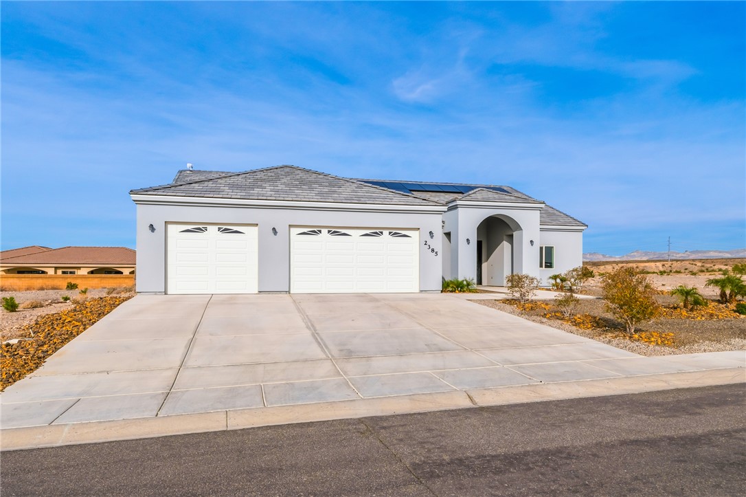 2385 Corwin Road Bullhead City, AZ 86442 - Photo 3 of 78 a front view of a house with a yard
