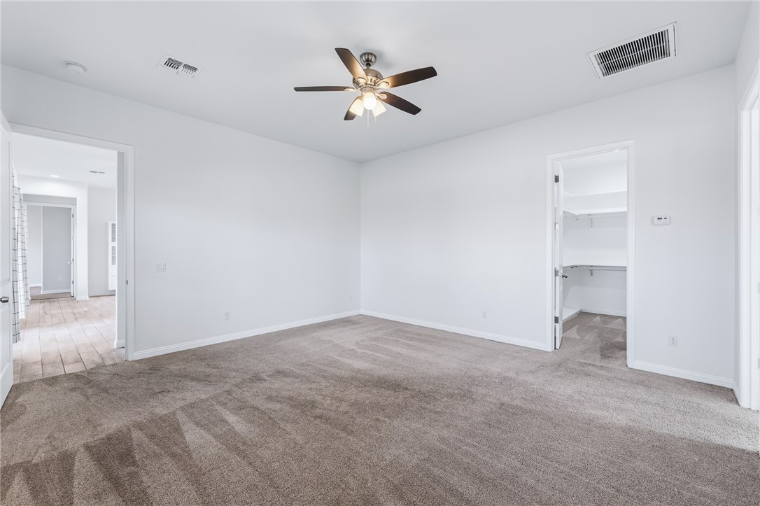 2385 Corwin Road Bullhead City, AZ 86442 - Photo 33 of 78 an empty room with closet and ceiling fan