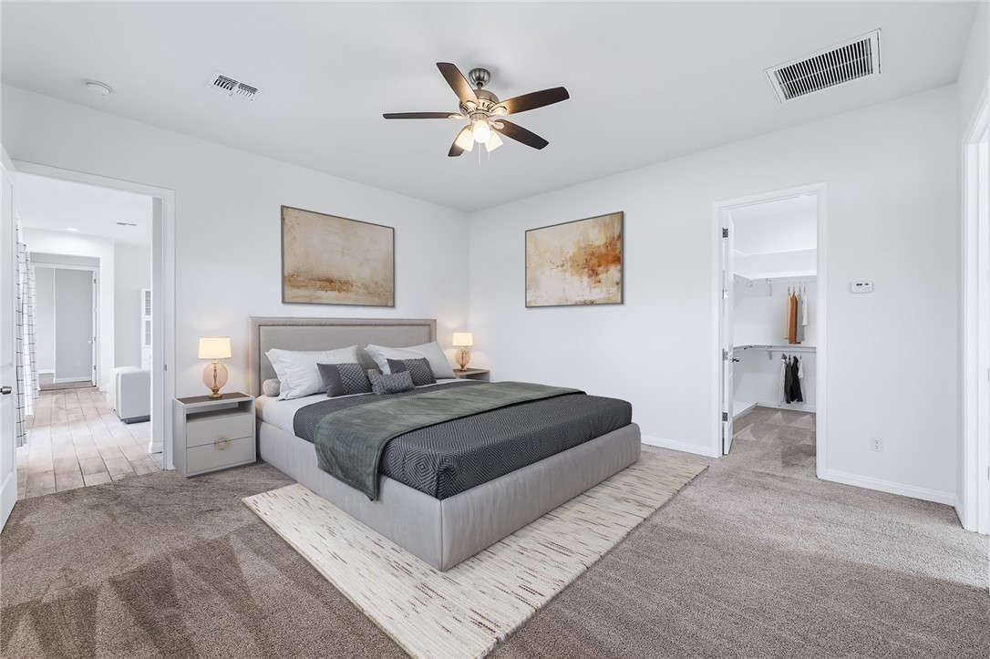 2385 Corwin Road Bullhead City, AZ 86442 - Photo 34 of 78 a spacious bedroom with a bed and ceiling fan