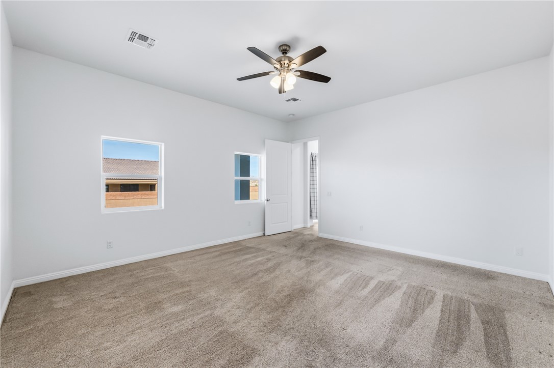 2385 Corwin Road Bullhead City, AZ 86442 - Photo 35 of 78 a view of an empty room with a ceiling fan
