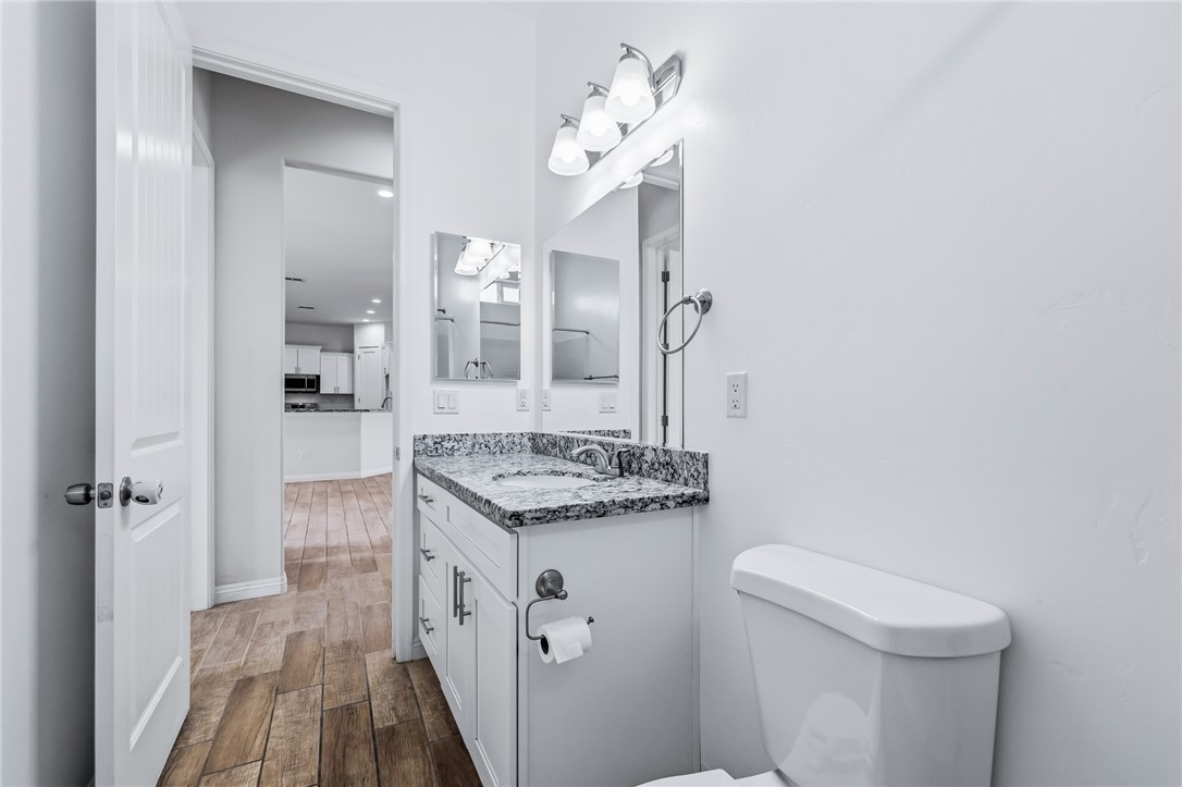 2385 Corwin Road Bullhead City, AZ 86442 - Photo 45 of 78 a spacious bathroom with a granite countertop sink a toilet and shower