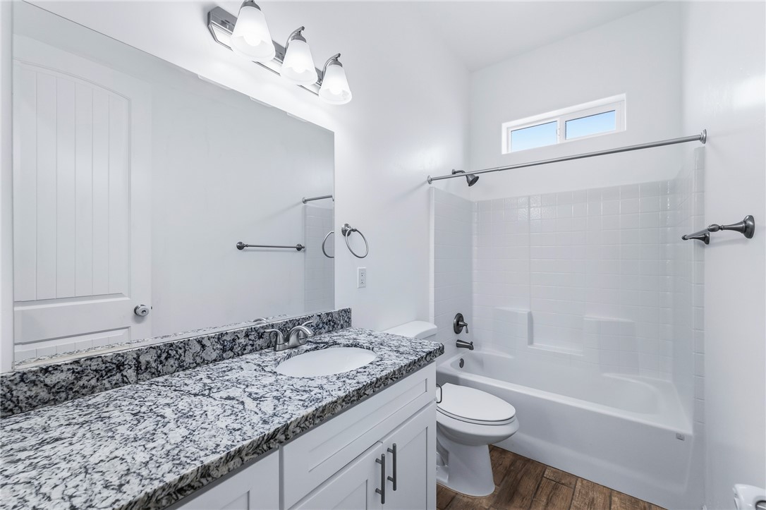 2385 Corwin Road Bullhead City, AZ 86442 - Photo 46 of 78 a bathroom with a granite countertop sink toilet and shower