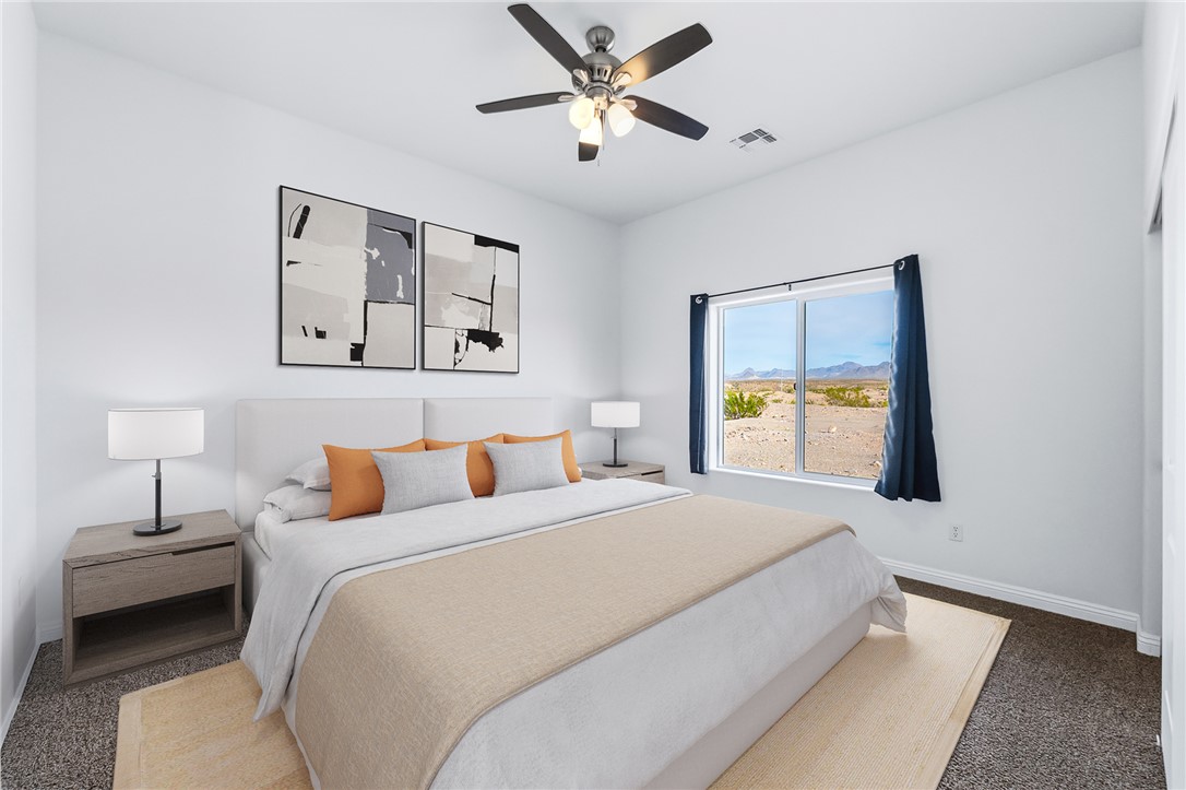 2385 Corwin Road Bullhead City, AZ 86442 - Photo 48 of 78 a bedroom with a bed and a chandelier