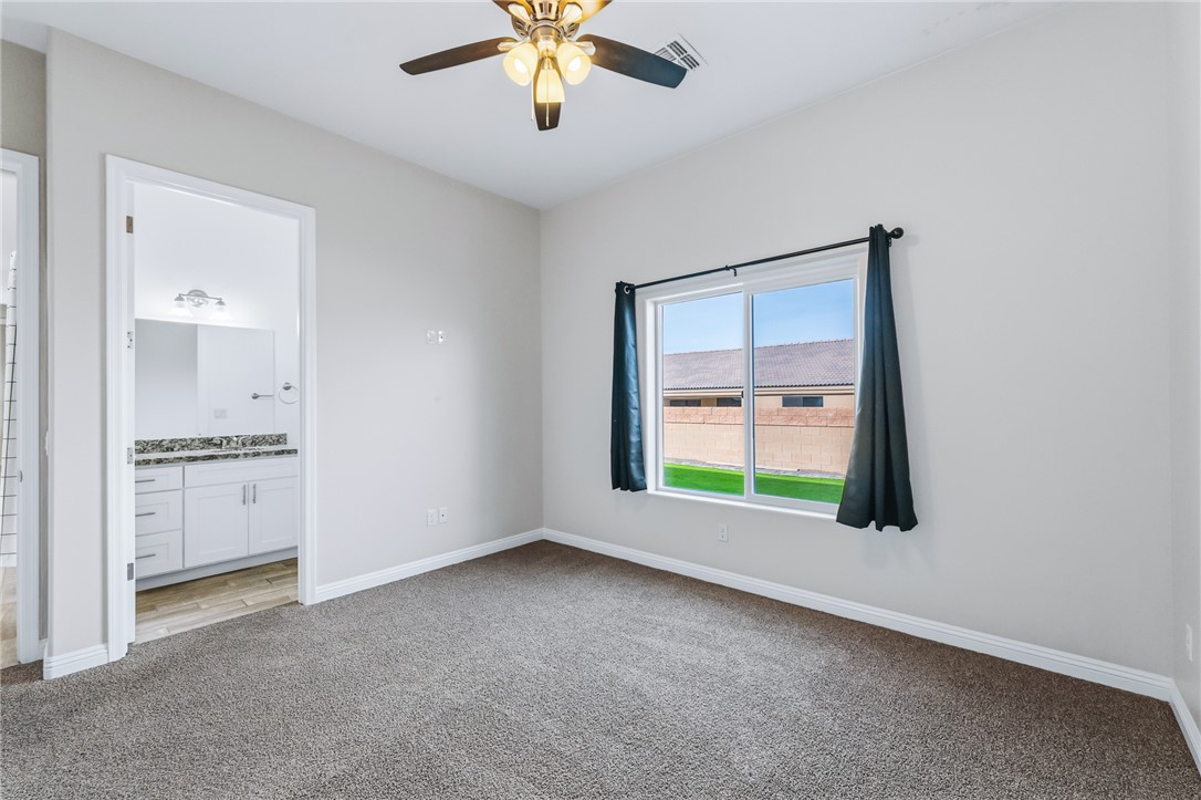 2385 Corwin Road Bullhead City, AZ 86442 - Photo 53 of 78 an empty room with windows and cabinet