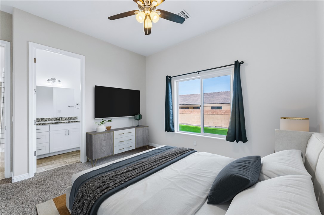 2385 Corwin Road Bullhead City, AZ 86442 - Photo 54 of 78 a bedroom with a bed and a flat screen tv