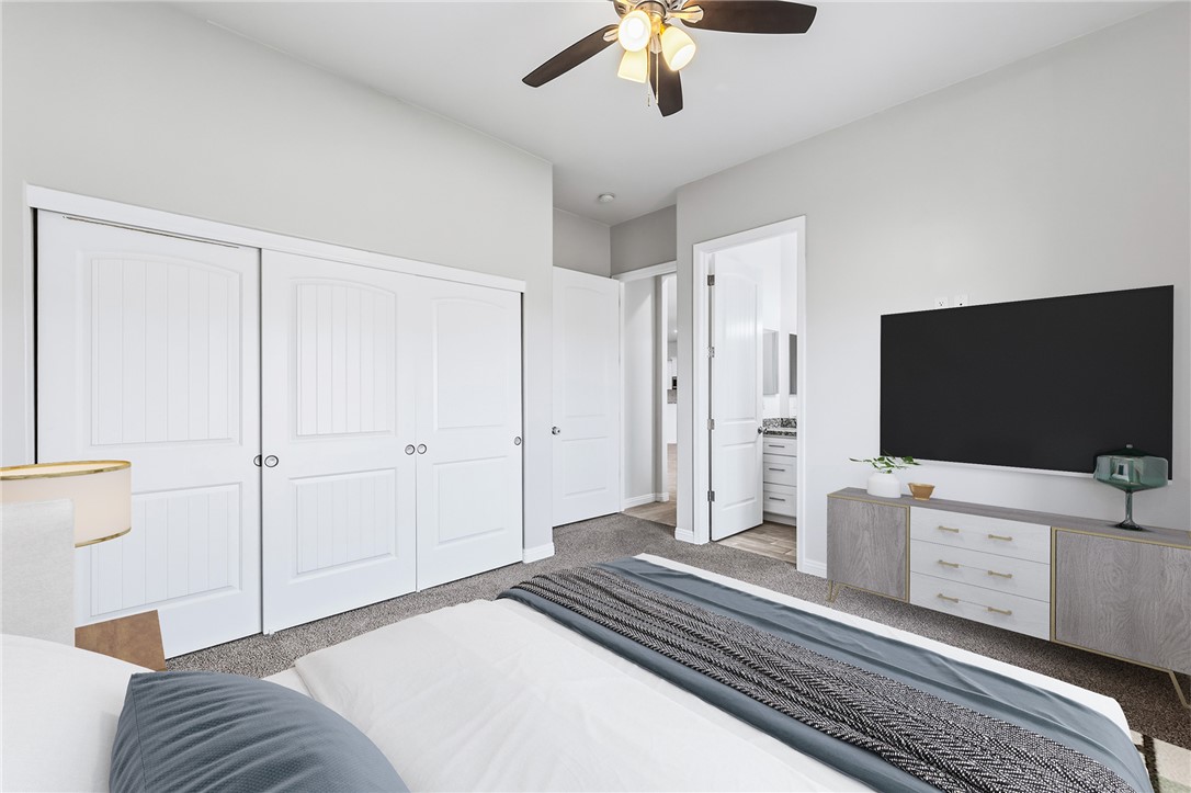 2385 Corwin Road Bullhead City, AZ 86442 - Photo 56 of 78 a bedroom with a bed and a flat tv screen on wall