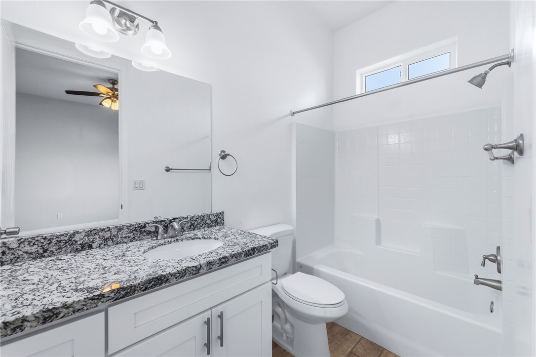 2385 Corwin Road Bullhead City, AZ 86442 - Photo 57 of 78 a bathroom with a granite countertop sink a toilet and shower