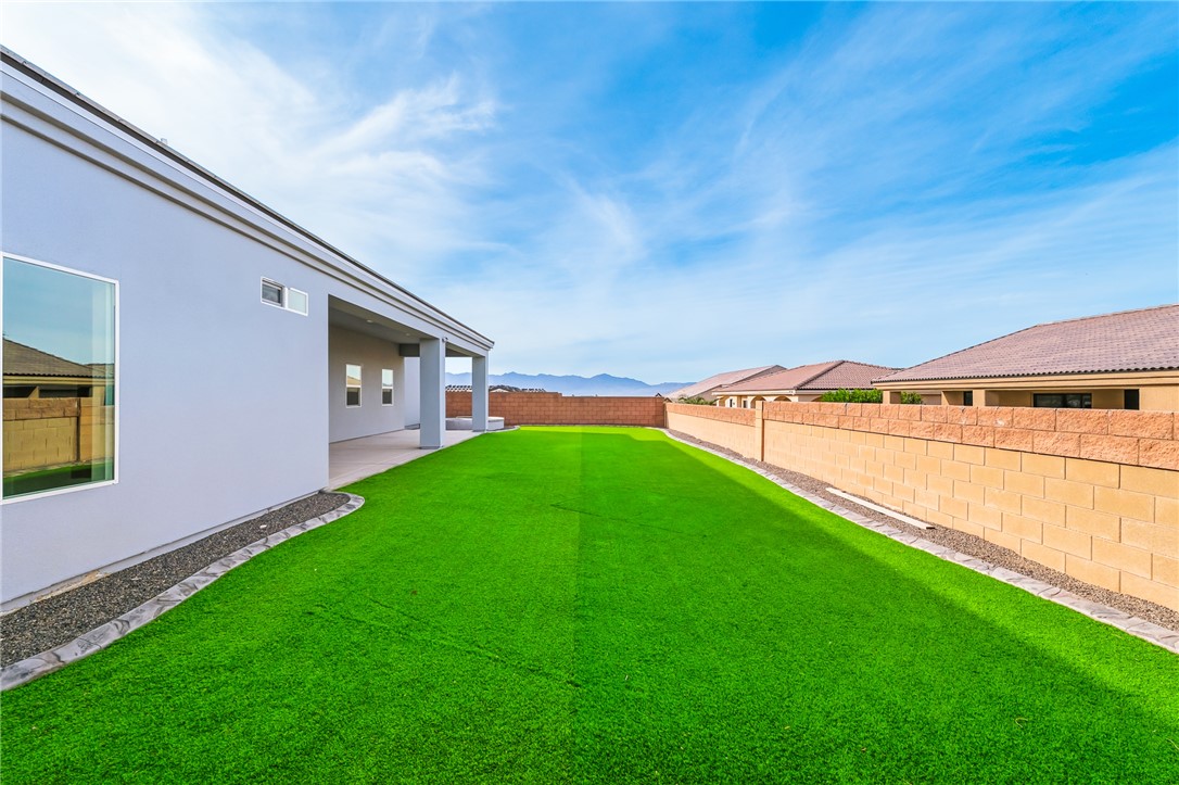 2385 Corwin Road Bullhead City, AZ 86442 - Photo 68 of 78 a view of an house with backyard and porch