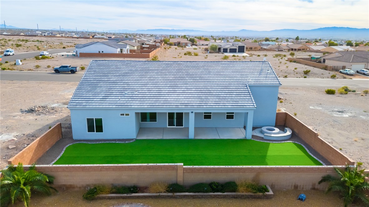 2385 Corwin Road Bullhead City, AZ 86442 - Photo 76 of 78 a view of a house with a yard and potted plants