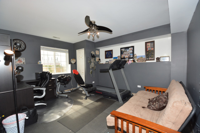 285 South Oak Creek Lane, Unit 285 Romeoville, IL 60446 - Photo 19 of 24 a view of a room with gym equipment