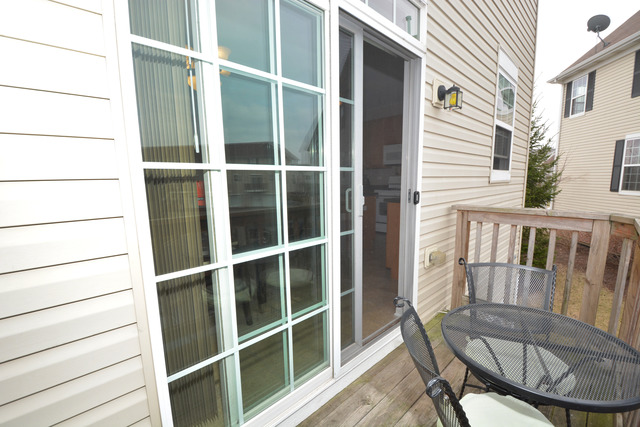 285 South Oak Creek Lane, Unit 285 Romeoville, IL 60446 - Photo 22 of 24 a view of a house with a wooden deck