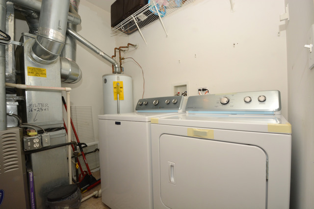 285 South Oak Creek Lane, Unit 285 Romeoville, IL 60446 - Photo 24 of 24 a utility room with dryer and washer
