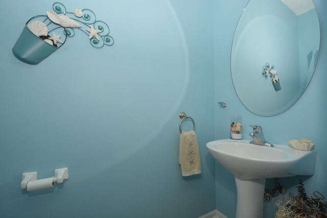 285 South Oak Creek Lane, Unit 285 Romeoville, IL 60446 - Photo 9 of 24 a bathroom with a sink and mirror