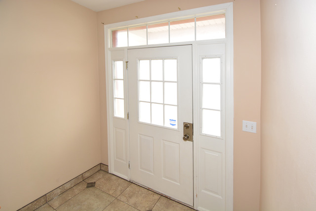 285 South Oak Creek Lane, Unit 285 Romeoville, IL 60446 - Photo 10 of 24 a view of an empty room with a window