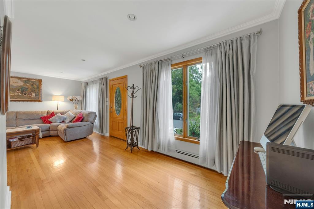 24 Cambridge Road Tenafly, NJ 07670 - Photo 6 of 31 a living room with furniture and a window