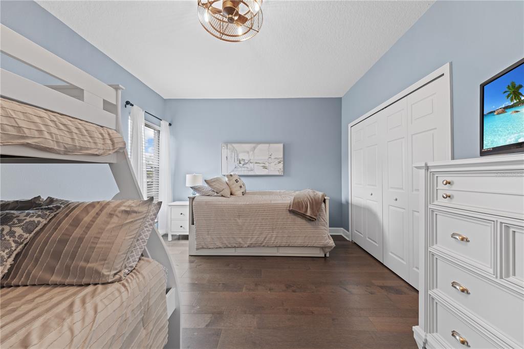 16948 Deer Island Road Tavares, FL 32778 - Photo 41 of 67 a bedroom with a bed and a window