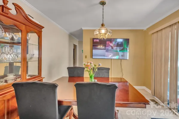a dining room with furniture and window