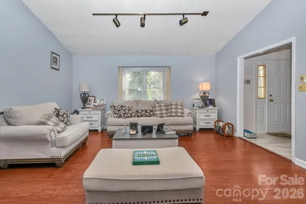 a living room with furniture and a table