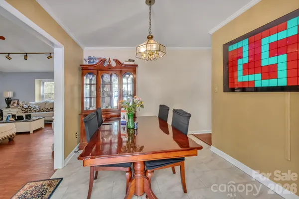 a view of a room with furniture and wooden floor