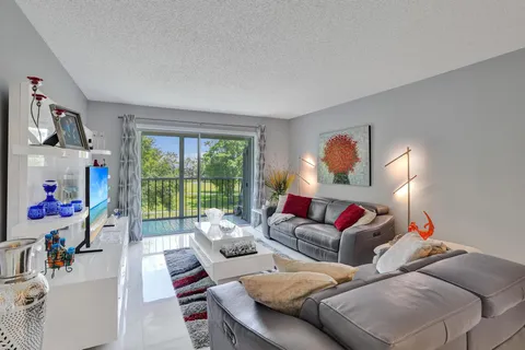 a living room with furniture fireplace and a flat screen tv