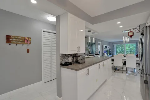 a kitchen with stainless steel appliances a stove a sink and a microwave