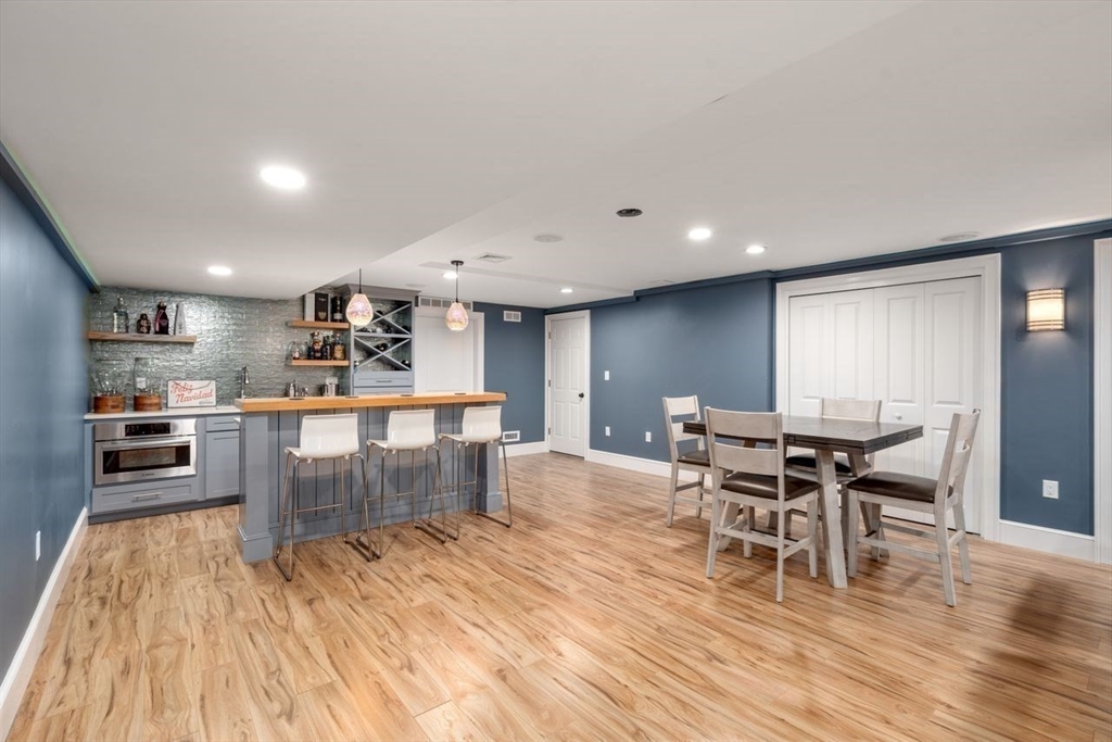 56 Blossomcrest Road Lexington, MA 02421 - Photo 28 of 29 a dining room with furniture and wooden floor