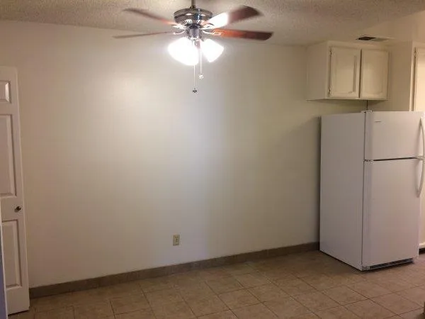 an empty room with a fireplace