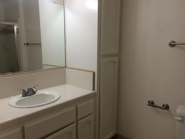 an aerial view of a house with a yard and garden