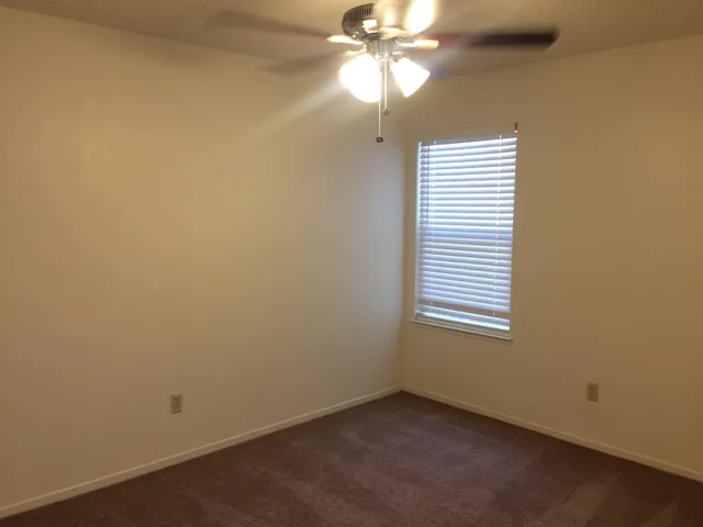 an aerial view of multiple houses with yard